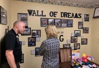Stutzman learns about Waterford Place's Wall of Dreams