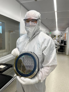 Dr. Scott Hammond with an NLM Photonics wafer