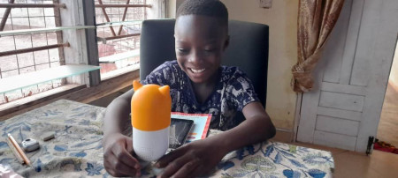 Child In Ghana Playing with ROYBI Robot