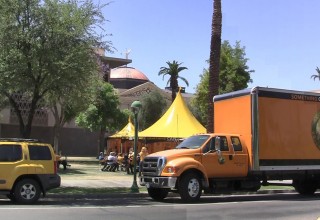 Bright yellow pavilion of the Scientology Volunteer Ministers