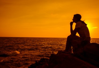 Woman Sitting Alone Thinking About Climate Change