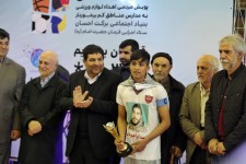 Youth receives award from Dr. Mohammad Mokhber