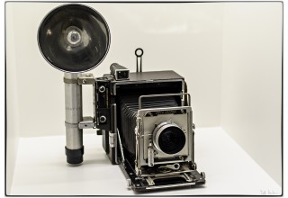 Example of a Graflex camera with flash gun.