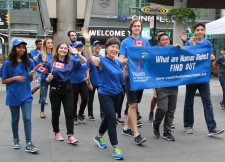 Volunteers from the Toronto chapter of Youth for Human Rights march in the 11th Youth Day Festival parade. 