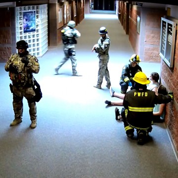 SchoolSAFE interoperable two-way radio communications between school staff and first responders was practiced in this active shooter rescue exercise at Pueblo West High School, Colorado, April 8, 2015.