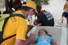 A Volunteer Minister gives a Scientology assist to a child, traumatized by the Peru floods.