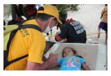 A Volunteer Minister gives a Scientology assist to a child, traumatized by the Peru floods.