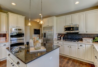 Designer kitchen showcased in a K. Hovnanian® home at The Estates Of Fox Chase in Oswego