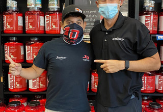Xfinity race car driver Ryan Vargas with NUTRISHOP store owner Ronnie Villanueva