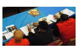 Community leaders study Youth for Human Rights educational materials