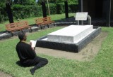 Anthony "Amp" Elmore does Buddhist Prayers at the grave of Kenya Hero Tom Mboya. Elmore wants the world to learn about Tom Mboya.