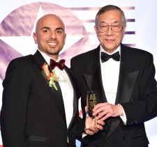 Nima Baiati receiving 50 Outstanding Asian Americans in Business Award from John Wang
