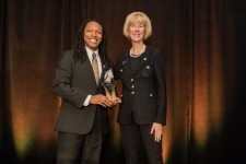 Jamison F. Gavin receiving 30 Under 30 Award with Julie Stroh, VP of UCF Alumni Engagement 
