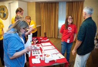 Ms. Wendi Hayden, Red Cross National Capital Area Disaster Program Manager, at the Red Cross booth at the World Humanitarian Day Event at the Founding Church of Scientology, Washington, D.C.