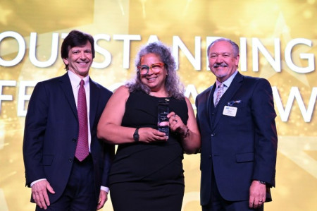 Myra Roldan (center) Accepts Prestigious Outstanding Professional Award