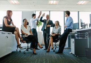 Group of Office Workers Sitting and Standing