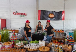 la Granja serving Patrons at the Doral Food and Wine Festival