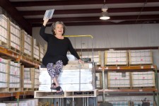 Lundy Wilder on a pallet of tile in Villa Lagoon Tile warehouse