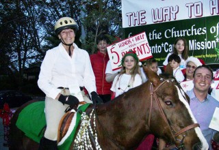 As the sun set December 2, volunteers from the Scientology Church and Missions of Sacramento prepared to begin their ride down Fair Oaks Boulevard in this year's Christmas in the Village Parade of Lights.