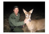 Officer Borkovich with deer that was hit by a car