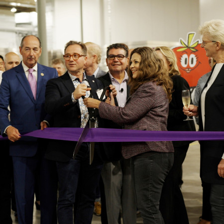 Founders Mike Zelkind and Tisha Livingston, joined by employees and special guests, open the farm