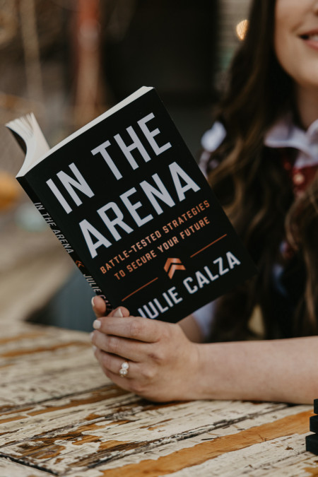 Julie Calza holding In The Arena