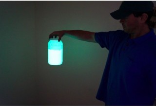 Holding a bottle of Glow in the Dark Pigment to make GLOW Filament