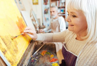 Older Woman Enjoying Painting